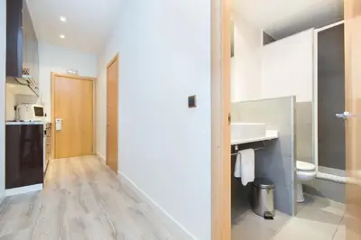 a bathroom with a sink and a toilet at Cathedral Apartments in Barcelona