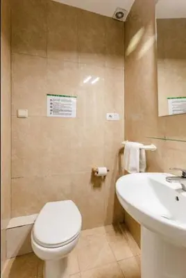 a bathroom with a white toilet and a sink at BELLAFILA GOTHIC in Barcelona