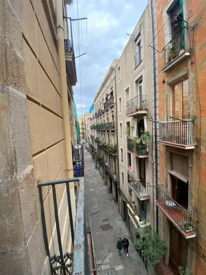 a view of an alley between two buildings at Esparteria 2 in Barcelona