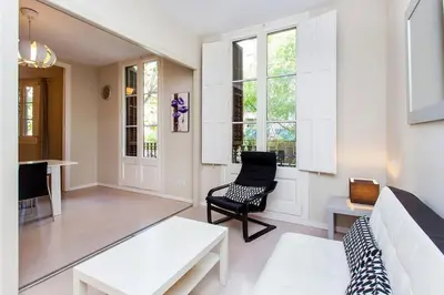 a living room with a couch and a chair at Stay U-nique Apartments Floridablanca II in Barcelona
