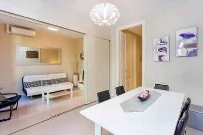 a dining room with a white table and chairs at Stay U-nique Apartments Floridablanca II in Barcelona