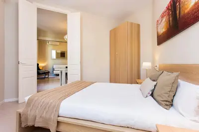 a bedroom with a large white bed in a room at Stay U-nique Apartments Floridablanca II in Barcelona