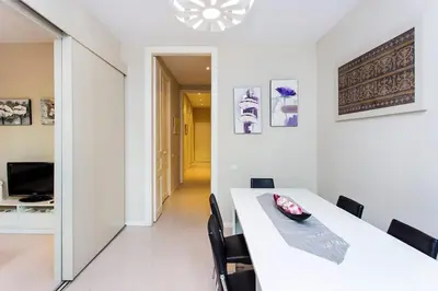 a white dining room with a white table and chairs at Stay U-nique Apartments Floridablanca II in Barcelona