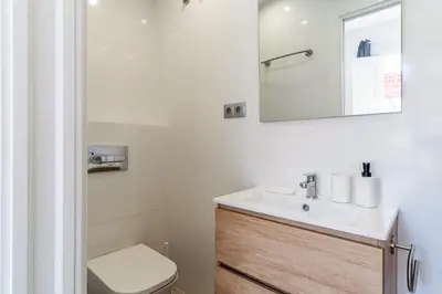 a bathroom with a sink and a toilet and a mirror at 236 - AB Poble Sec Montjuic in Barcelona