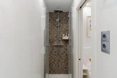a bathroom with a shower with a glass door at 236 - AB Poble Sec Montjuic in Barcelona