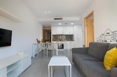 a living room with a couch and a table at BBarcelona Gaudí Flats in Barcelona
