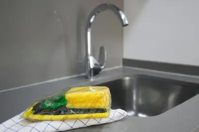 a glass dish sitting on a towel in a sink at BBarcelona Gaudí Flats in Barcelona