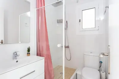 a bathroom with a shower and a toilet and a sink at Sagrada Familia Butterfly in Barcelona