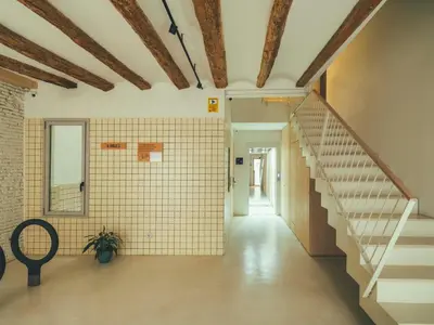 an empty hallway with stairs in a building at Boutique Apartments 23 Barcelona in Barcelona