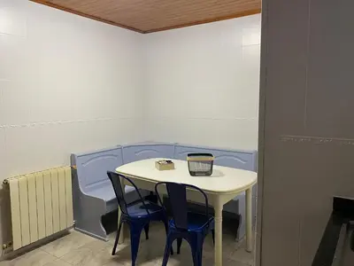 a small table with two chairs and a candle on it at Vilamarlux VI in Vilassar de Mar