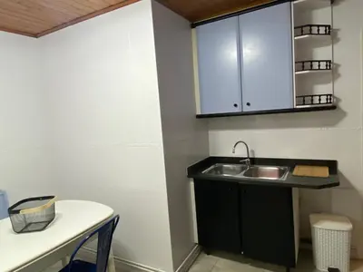 a kitchen with a sink and a counter top at Vilamarlux VI in Vilassar de Mar