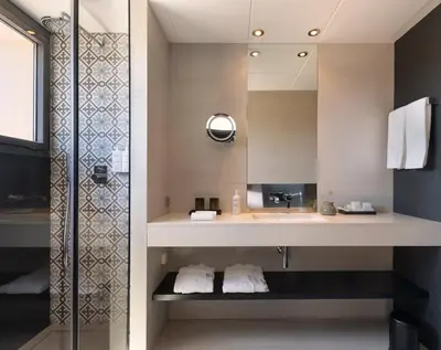 a bathroom with a sink and a shower at Hotel Casa Sagnier in Barcelona