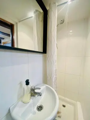 a bathroom with a sink and a mirror and a tub at 028 Apartament 2 2 in Barcelona