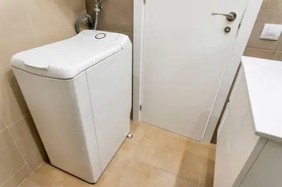 a white washer and dryer in a bathroom at Cozy&new With Terrace in Hospitalet de Llobregat