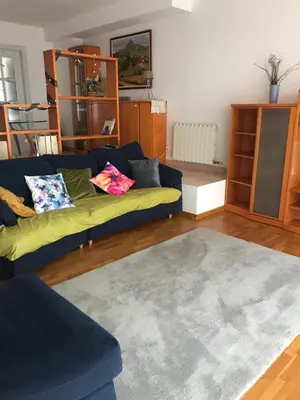 a living room with a couch and a rug at Gran apartamento de 4 habitaciones en Sitges in Sitges