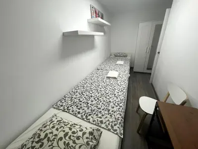 a small room with a bed and a desk at Sant Adria Beach apartment Wi-Fi Parking Free in Sant Adria de Besos
