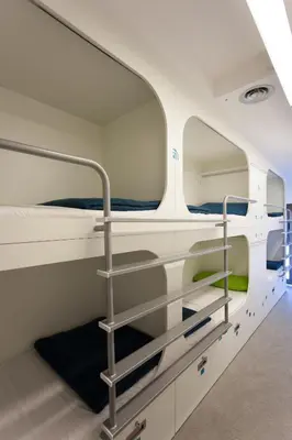 a room with two bunk beds and a mirror at Dream Cube Hostel in Barcelona