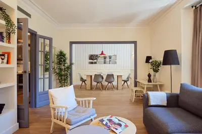 a living room with a couch and chairs and a table at Casa Cosi - Casanova 2 in Barcelona