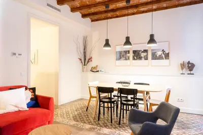 a living room with a table and chairs at Casa Cosi - Putxet 3 in Barcelona