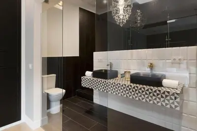 a bathroom with two sinks and a toilet at Casa Cosi - Terrace 1 in Barcelona