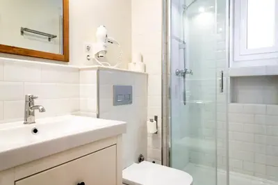 a bathroom with a sink toilet and a shower at Casa Cosi - Putxet 1 in Barcelona