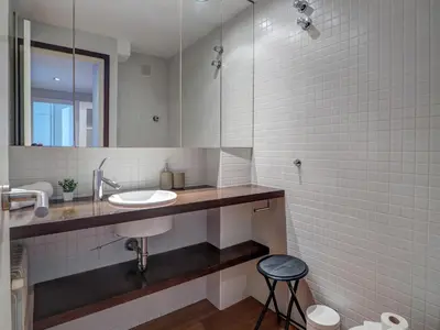 a bathroom with a sink and a mirror at Balmins Surf by Hello Homes Sitges in Sitges
