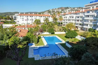 an aerial view of a resort with a swimming pool at Balmins Surf by Hello Homes Sitges in Sitges