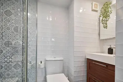 a bathroom with a toilet and a shower and a sink at Love Local Life Near Sagrada Familia by MyRentalHost in Barcelona
