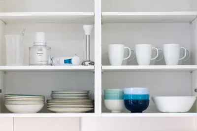 a cabinet filled with dishes and cups and plates at 8 lacus duplex in Hospitalet de Llobregat