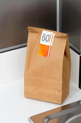 a brown bag sitting on top of a desk at 8 lacus BAIKAL in Hospitalet de Llobregat