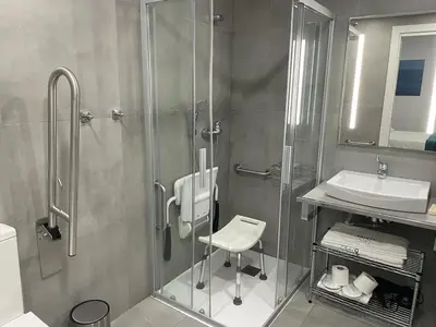 a bathroom with a shower and a toilet and a sink at 8 lacus VICTORIA in Hospitalet de Llobregat