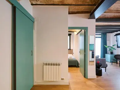 a room with a white wall and a radiator at Casa Wilson by MyRentalHost in Barcelona