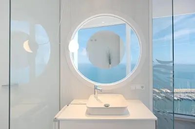 a bathroom with a sink and a mirror at Hotel Marina Badalona in Badalona