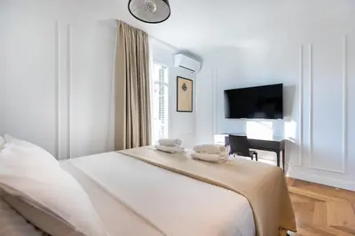 a bedroom with a bed with two towels on it at Majestic 4BR/4BATH apartment in Sagrada Familia area in Barcelona
