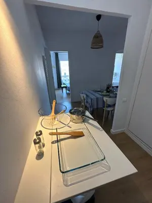 a white table with glasses on top of it at Plaza Spain Barcelona Apartments in Barcelona