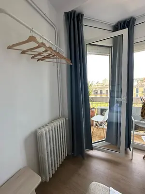 a living room with a radiator and a window at Plaza Spain Barcelona Apartments in Barcelona