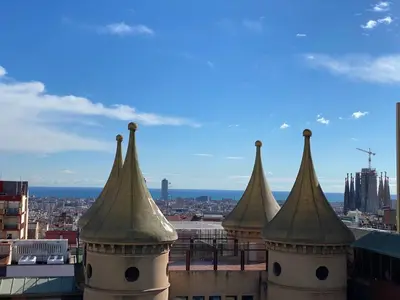 a view of a city from the top of a building at Amazing sea and Sagrada Familia views homey apartment in Barcelona