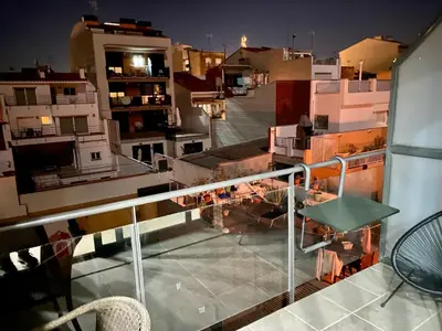 a view of a city at night from a balcony at Terraza Relajante Galvani in Terrassa