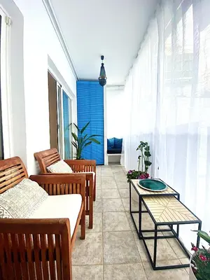 a balcony with two chairs and a table at Abbott apartment - 1 min from the beach - 100m2 - sleeps 8 in Sitges