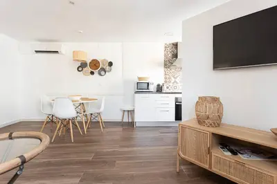 a living room with a television on a wall at Stylish&bright Close To Subway in Esplugues de Llobregat