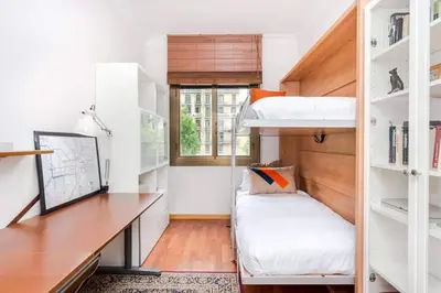 a room with a desk and a bunk bed at Central 2 Bedroom By Sagrada Familia in Barcelona