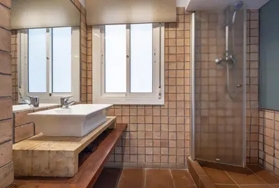 a bathroom with a sink and a shower at Caliu Apartments Barcelona - Fira in Hospitalet de Llobregat