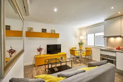 a living room with a couch and a table at BBarcelona Sant Pau Flat in Barcelona
