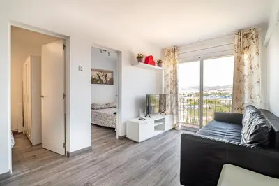 a living room with a couch and a window at LOVELY APARTMENT Barca 2 in Sant Adria de Besos