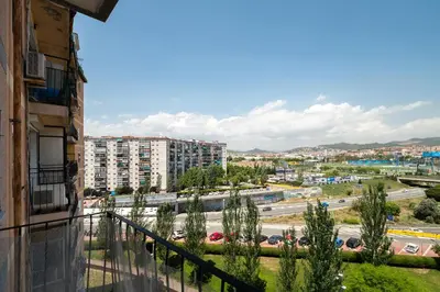 a balcony with a view of a city at LOVELY APARTMENT Barca 2 in Sant Adria de Besos