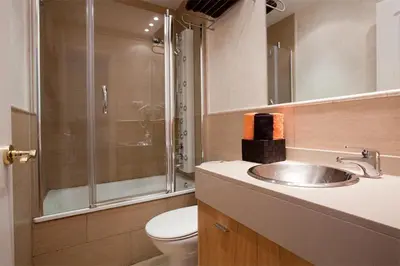 a bathroom with a sink and a shower and a toilet at rentBCN Gracia Jardinets in Barcelona
