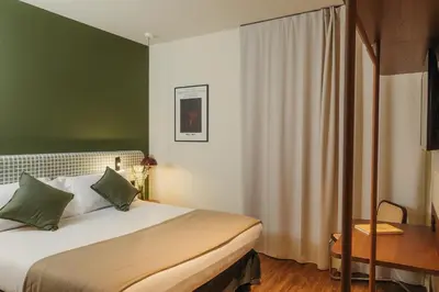 a hotel room with a bed and a desk at H Regas Adults Only in Barcelona