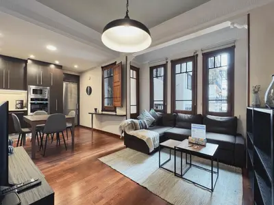 a living room with a couch and a table at Stay U-nique Apartments Industria II in Barcelona