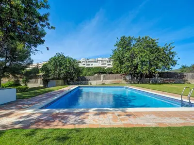 a swimming pool in the yard of a house at Molins Apartment by Hello Homes Sitges in Sitges