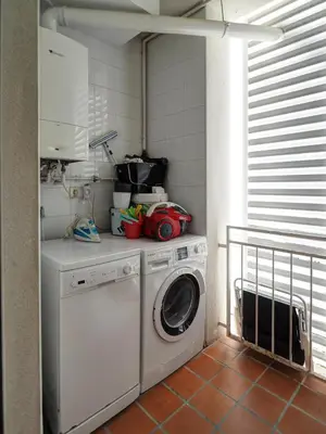 a laundry room with a washing machine in it at Molins Apartment by Hello Homes Sitges in Sitges